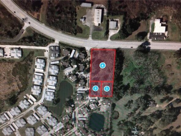 Aerial view of vacant land near homes.