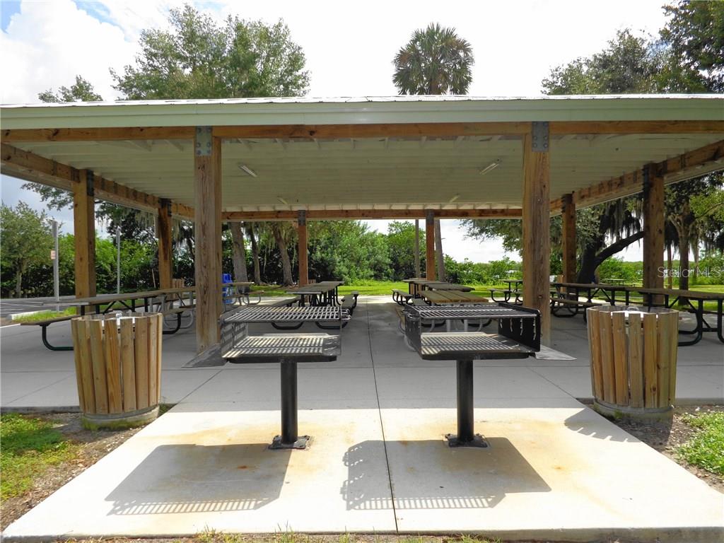 Two grills under a covered picnic area.