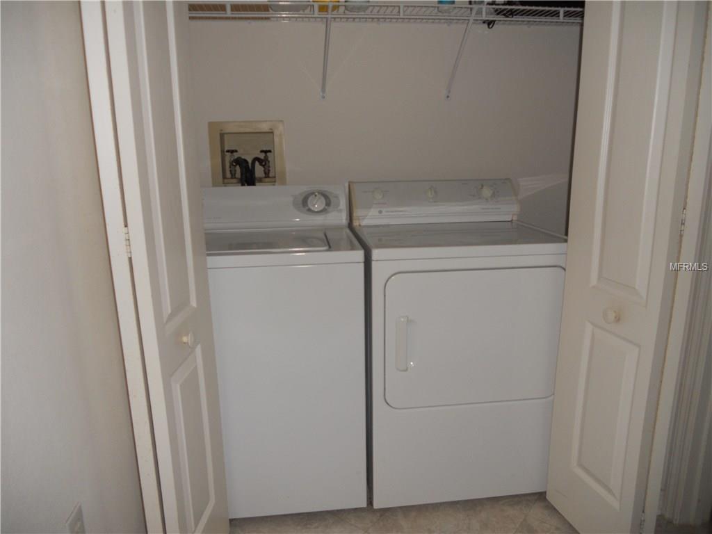 White washer and dryer in a laundry room.