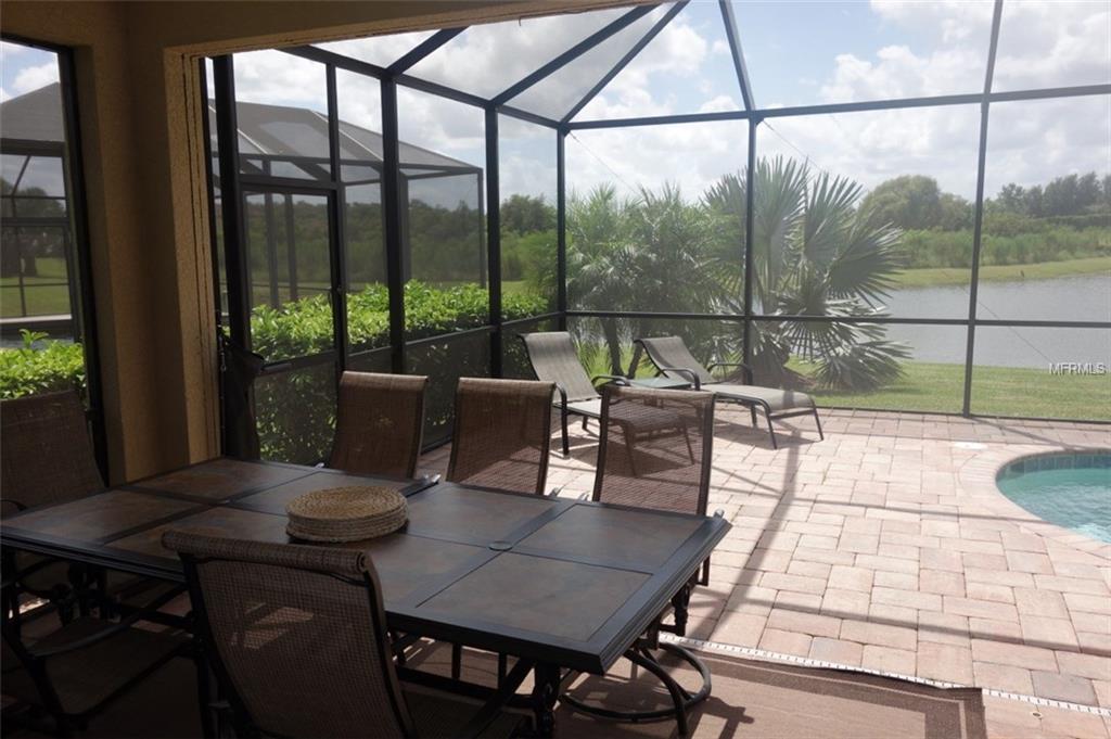 Patio dining set with lake view.