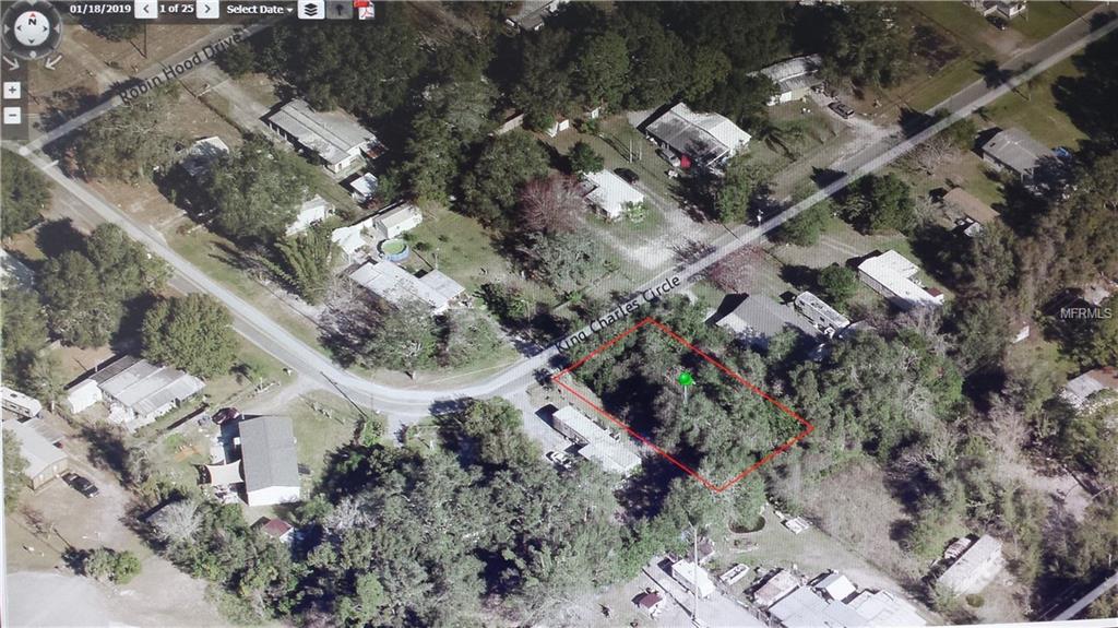 Aerial view of vacant lot in woods.