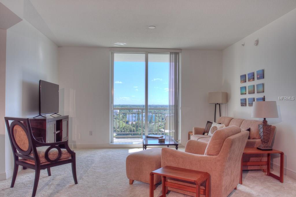 Living room with city view and couch.