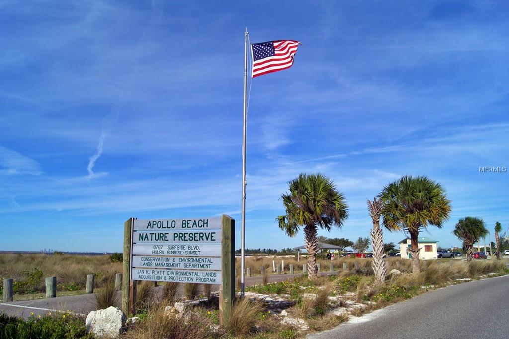 Apollo Beach Nature Preserve sign with US flag.