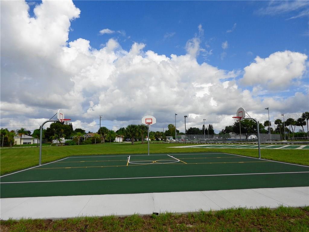 Basketball court with three hoops.