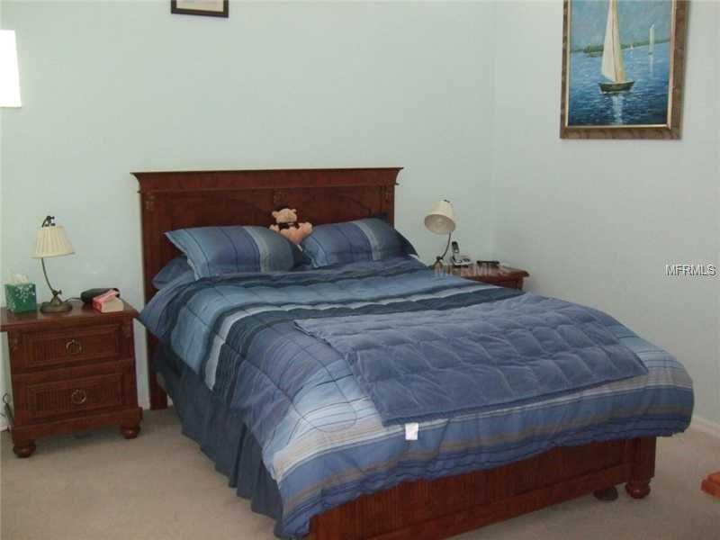 Blue and white bedding in a bedroom.