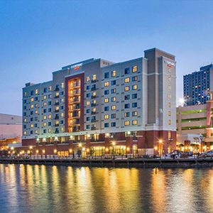 A large hotel building by the water.