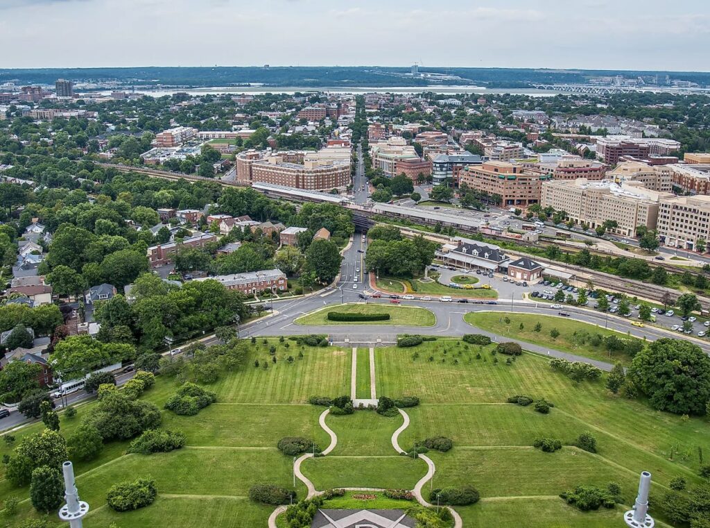 Aerial view of city park with train tracks.