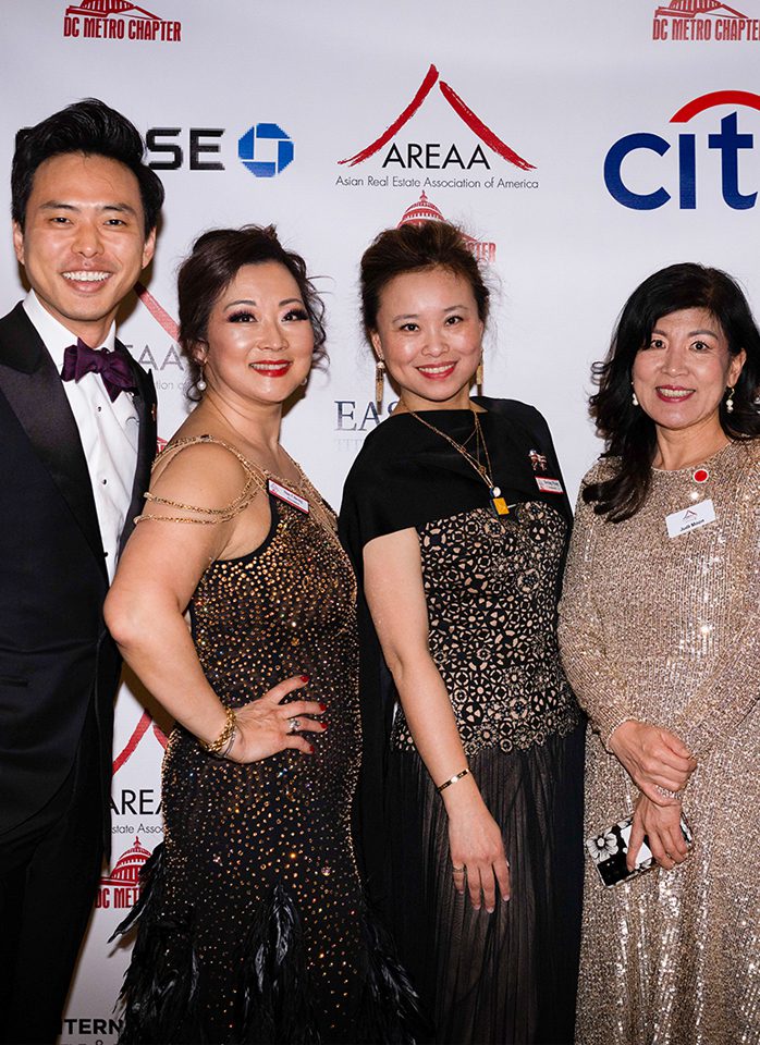 Four people at an awards ceremony.