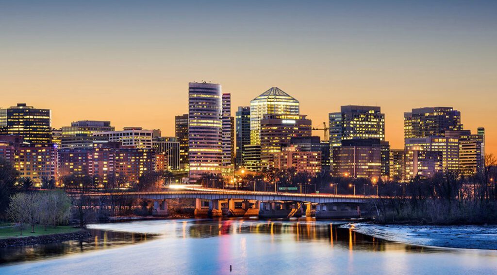 City skyline at twilight with river.