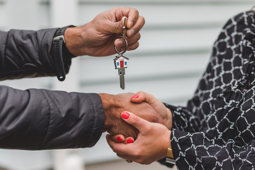 Handing over house keys to new owners.