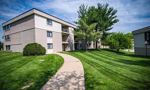 A path leading to an apartment building.