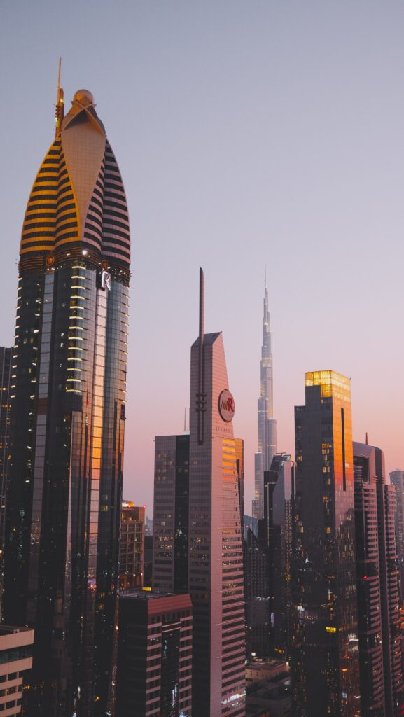 Cityscape of Dubai skyscrapers at sunset.