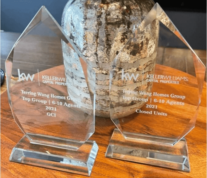 Two Keller Williams awards for top agents.