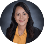 Headshot of a woman with long black hair.