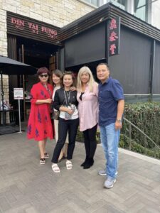 Group of friends pose in front of Din Tai Fung.