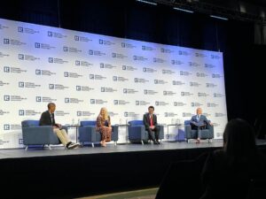 Four panelists at National Association of Realtors stage.