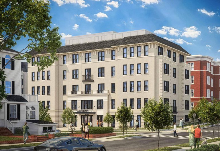 White brick apartment building with people walking by.