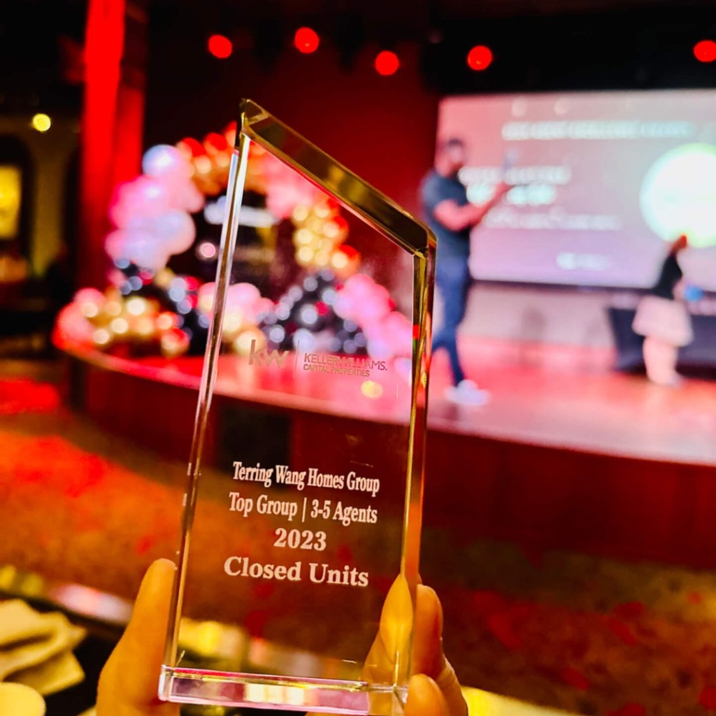 Award trophy with blurred stage background.