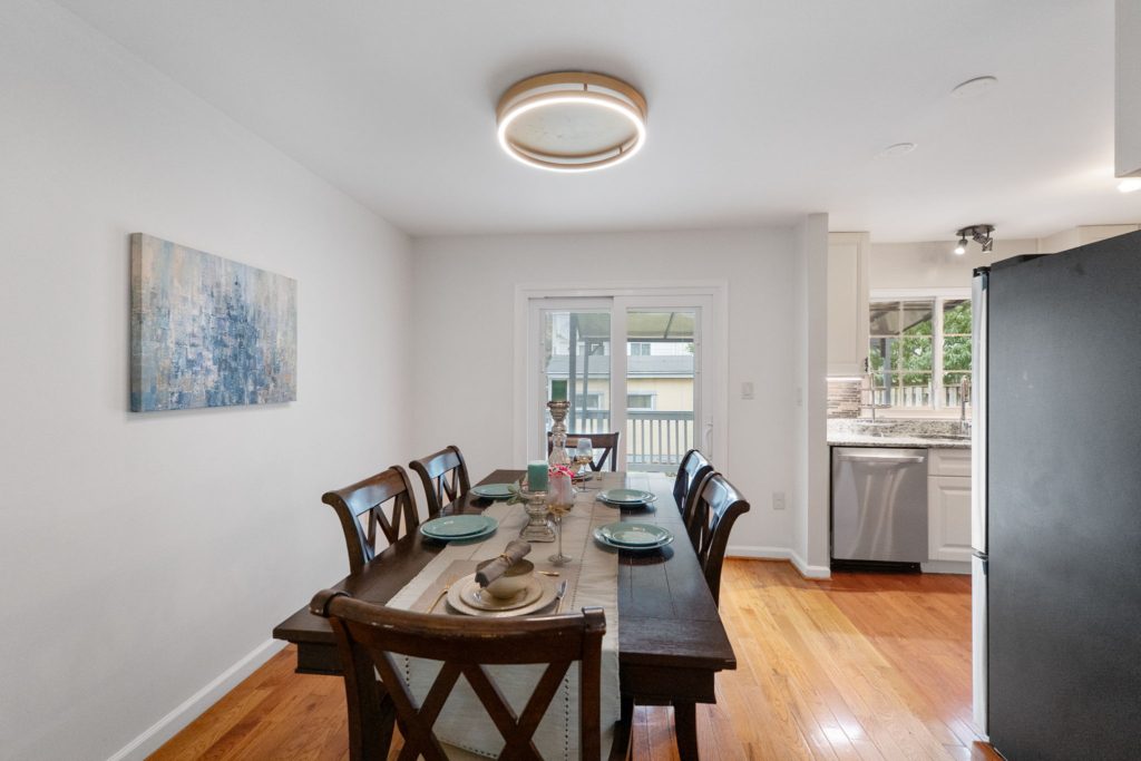 Dining room with wooden table and chairs.